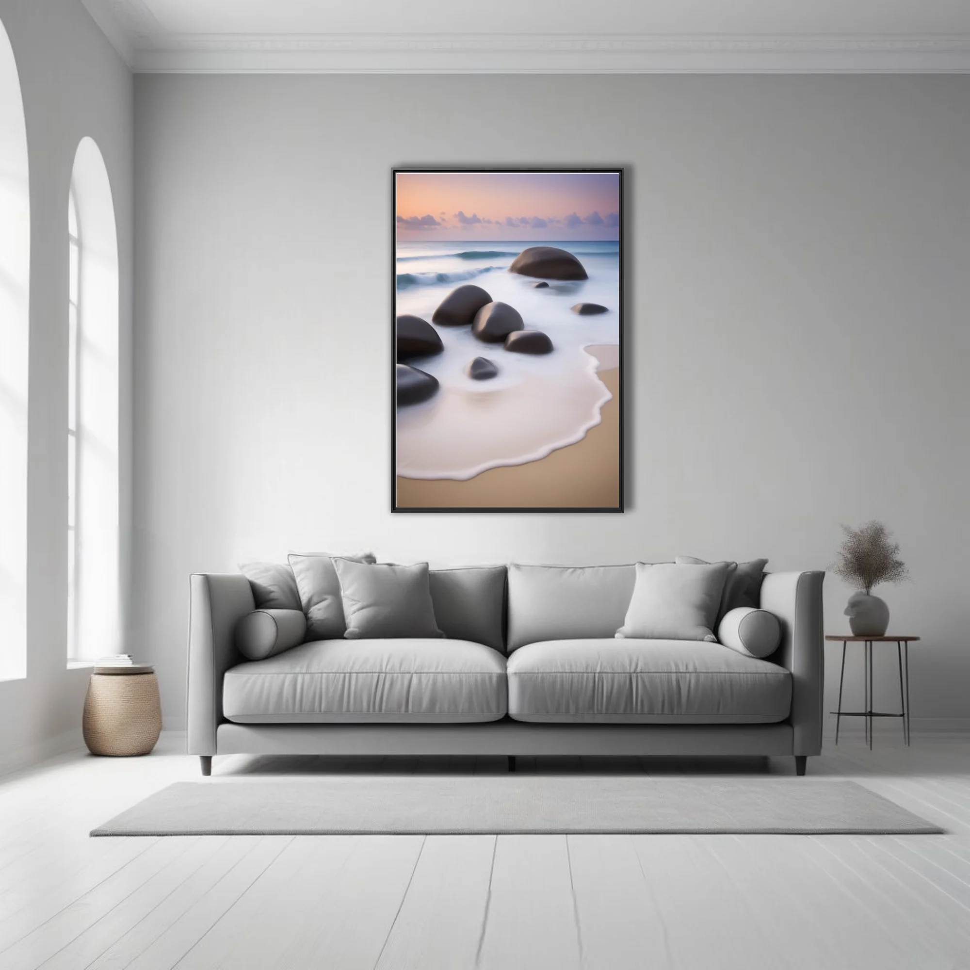 Long-exposure seascape with smooth boulders, silky foam, and pastel dusk sky