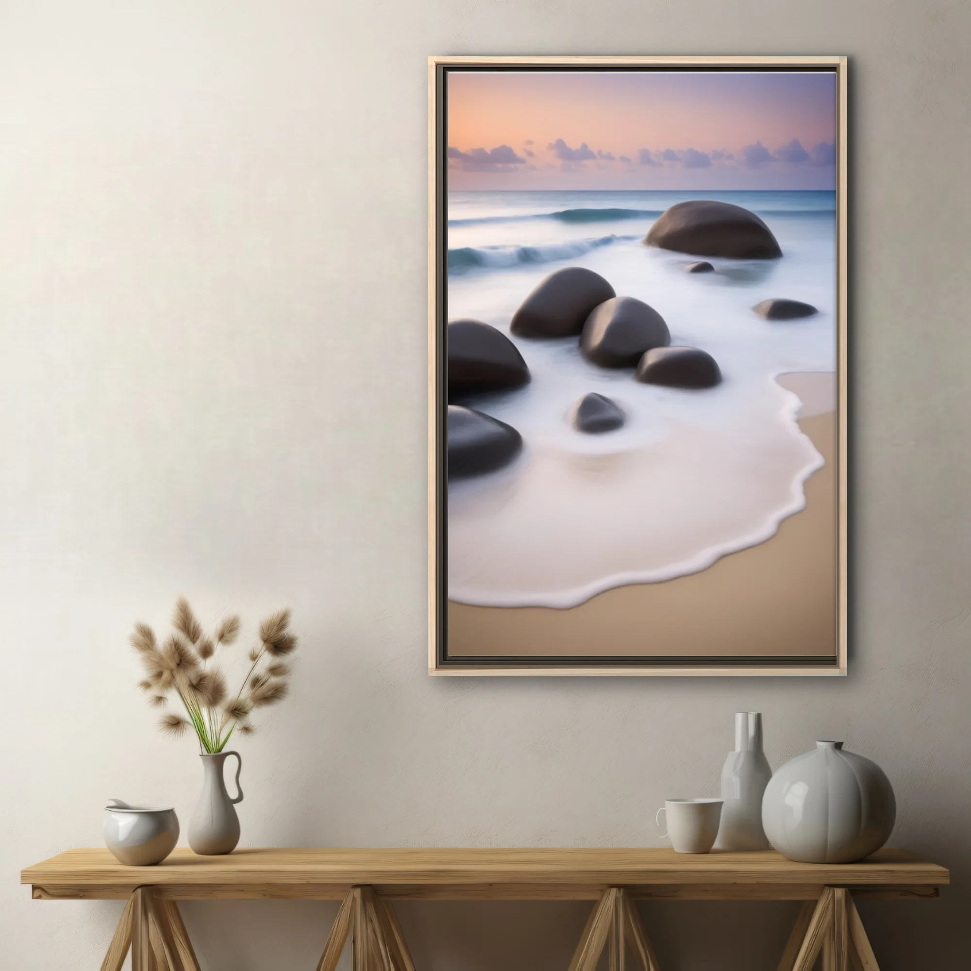 Long-exposure seascape with smooth boulders, silky foam, and pastel dusk sky